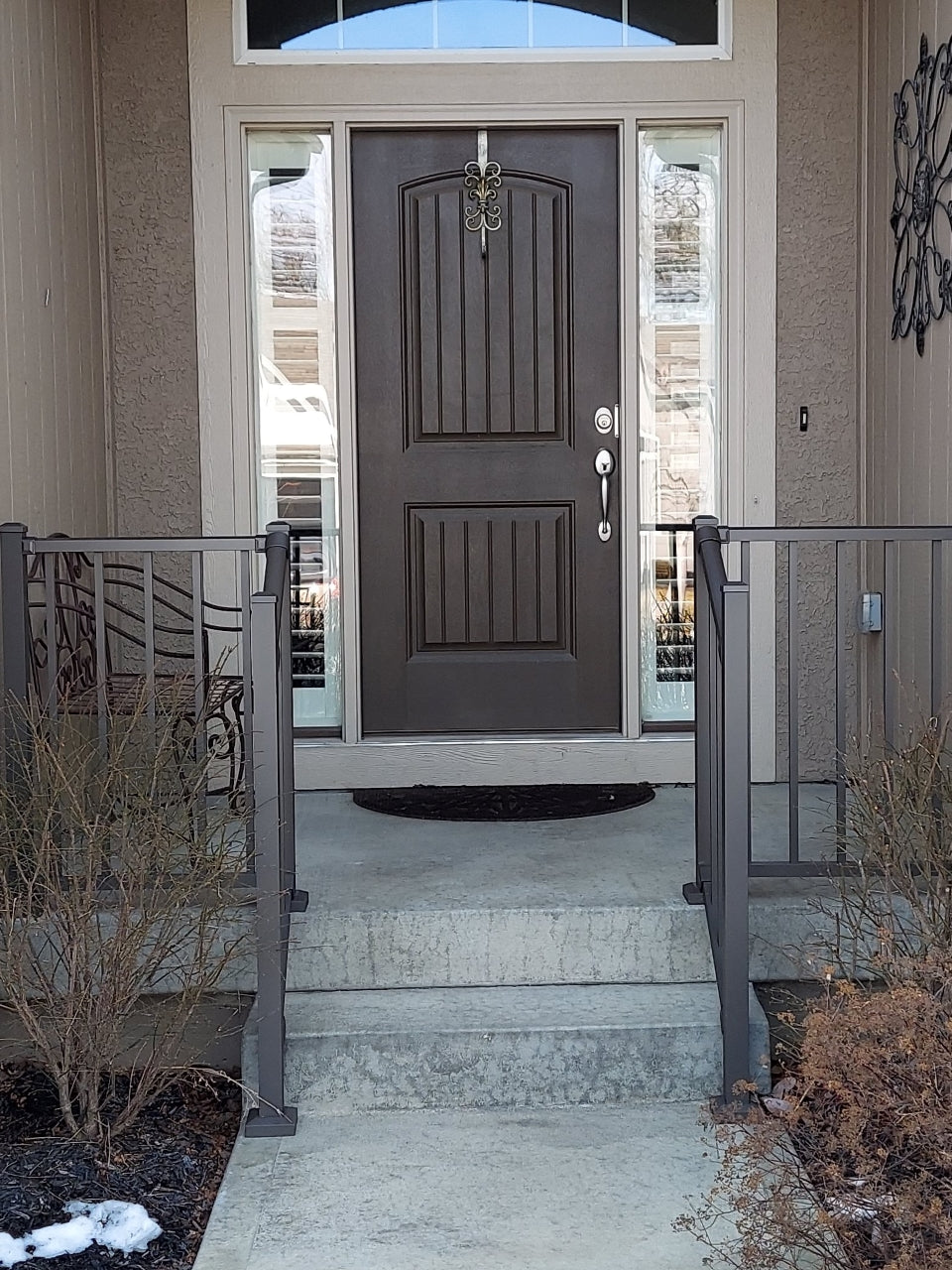 Front step guardrail aluminum railing westbury tuscany c10 in bronze texture level railing on the sides and stair railing down the concrete steps in the middle of stoop, the bronze railing matches the door and house color nicely 